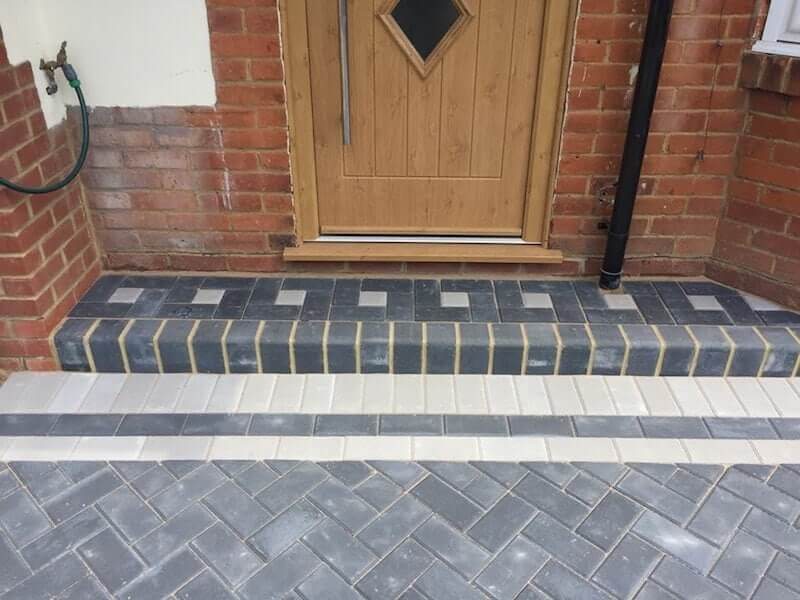 Block paving detail around a curved entrance step